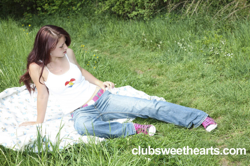 Charlotte plays with her toy in a park