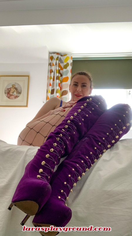 Purple Boots and fishnet tights